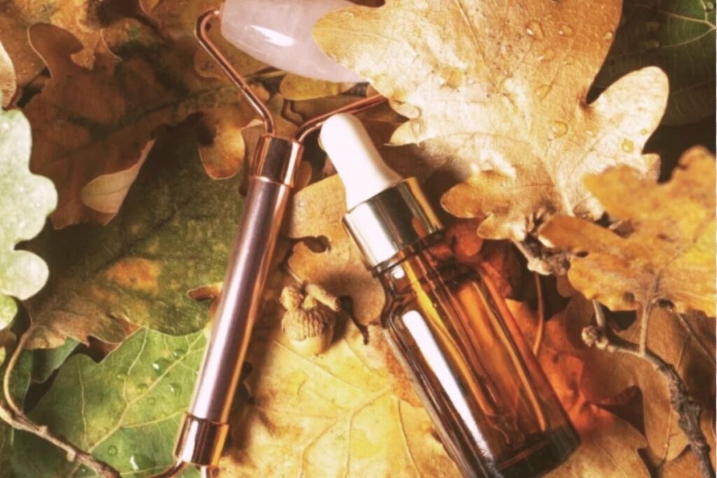 Fall skincare routine for sensitive skin featuring hydrating serum and autumn leaves